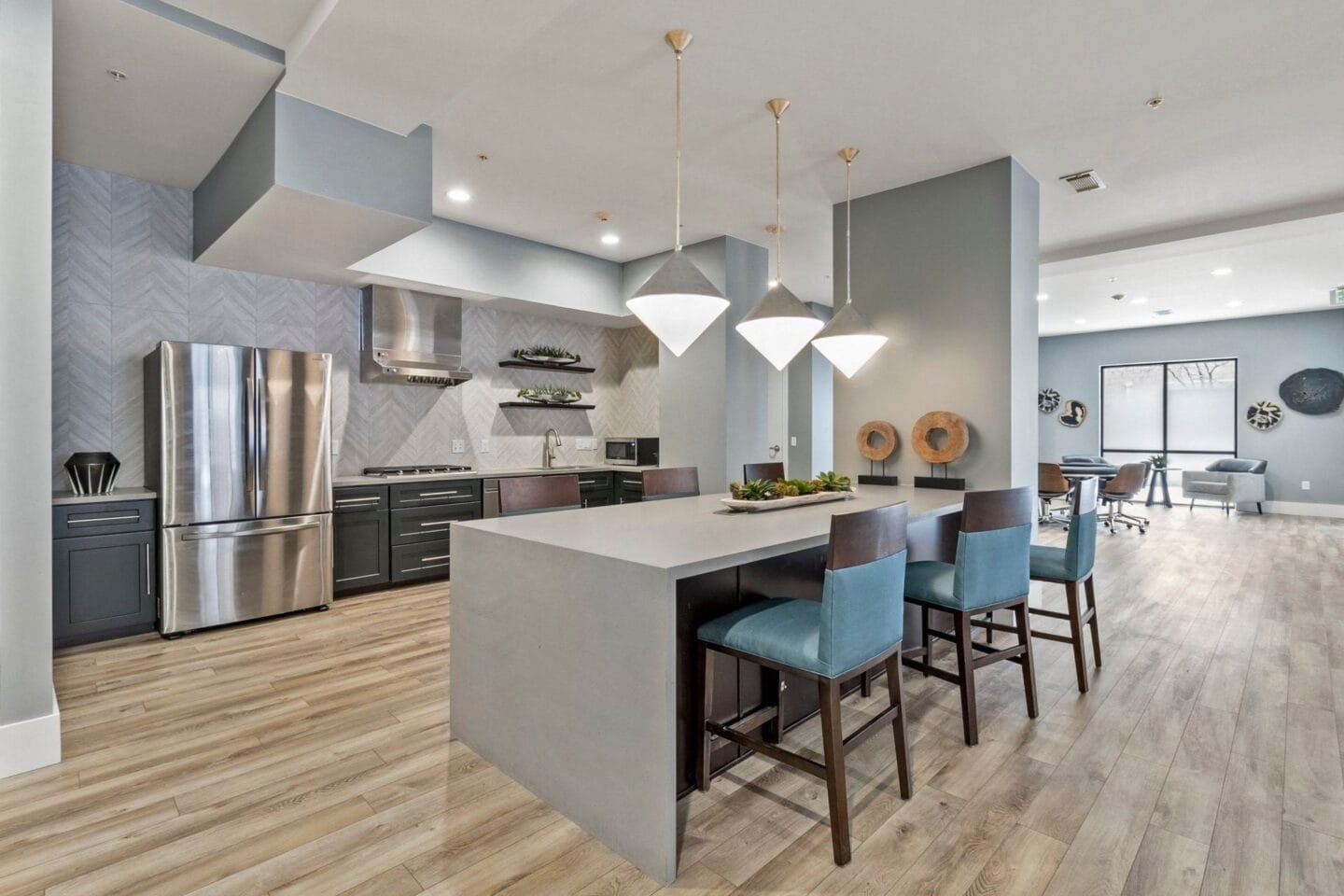 Fully equipped clubhouse kitchen with breakfast bar at The Manhattan Tower and Lofts, Denver, 80202.