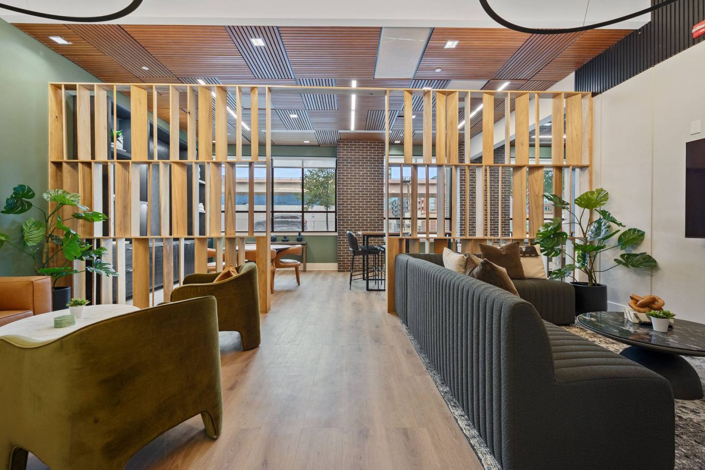 A modern lounge area with wooden furniture at The Casey, Colorado 80202