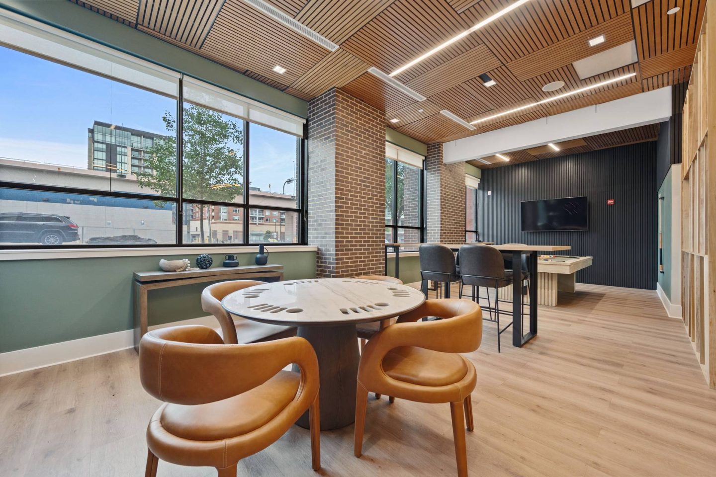 A conference room with a table and chairs and a pool table at The Casey, Colorado 80202