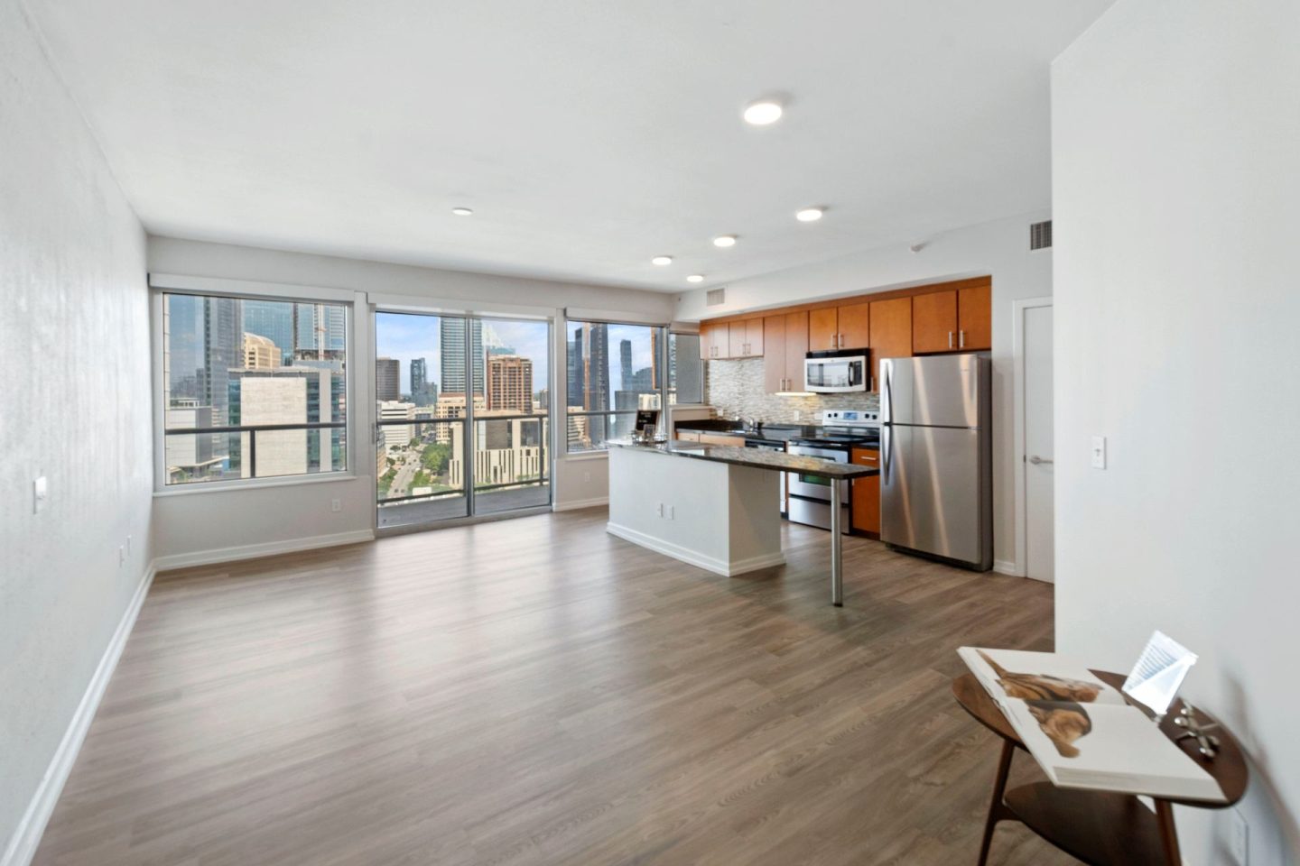 A kitchen with a view of the city.