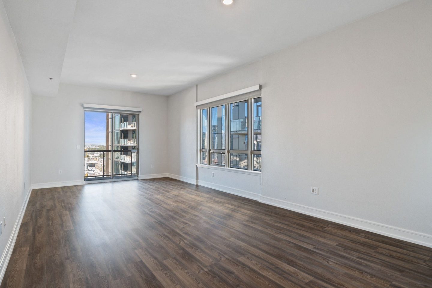 Large living room areas with oversized windows at Windsor on the Lake, 43 Rainey Street Austin, TX 78701