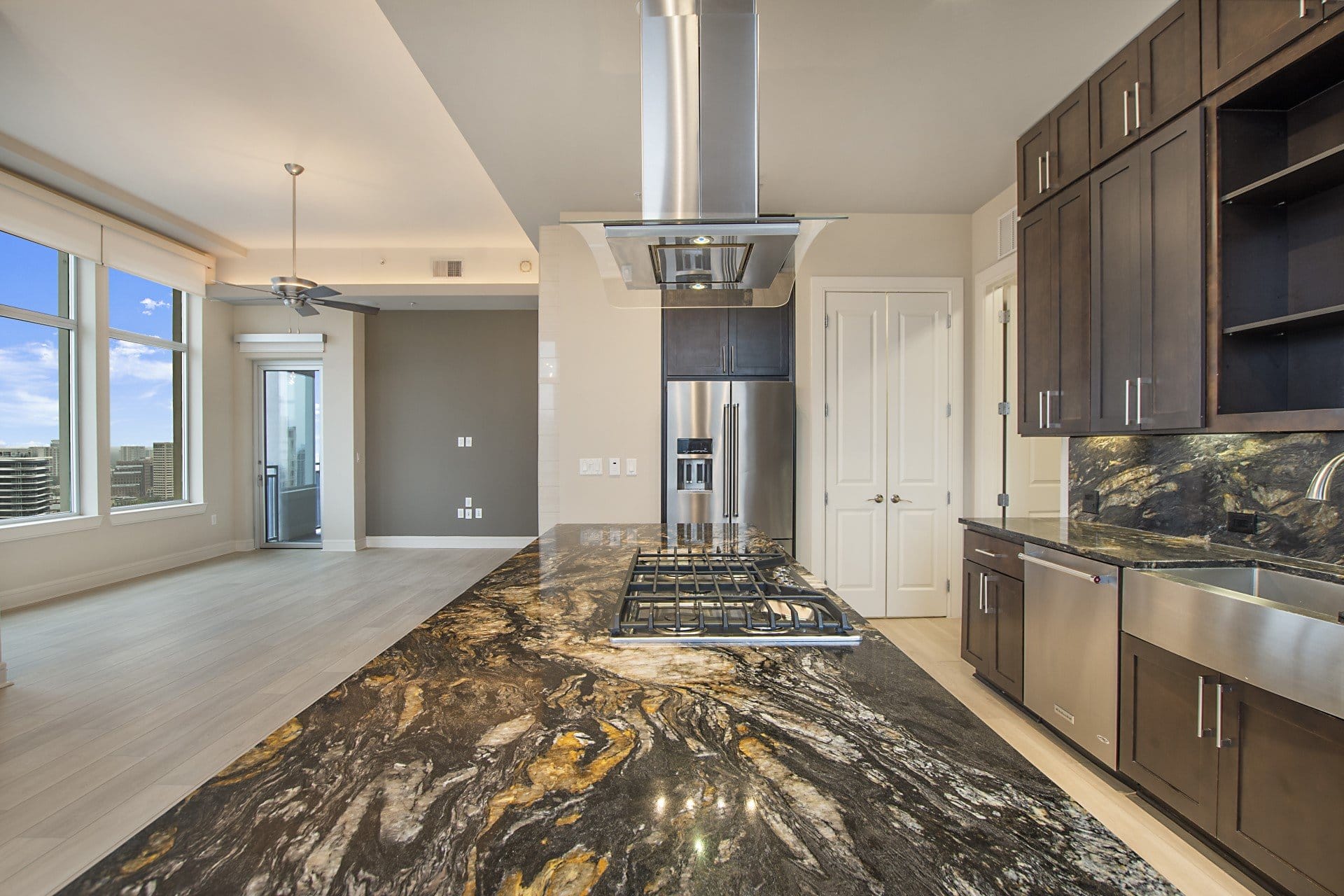a kitchen with granite counter tops and a large island