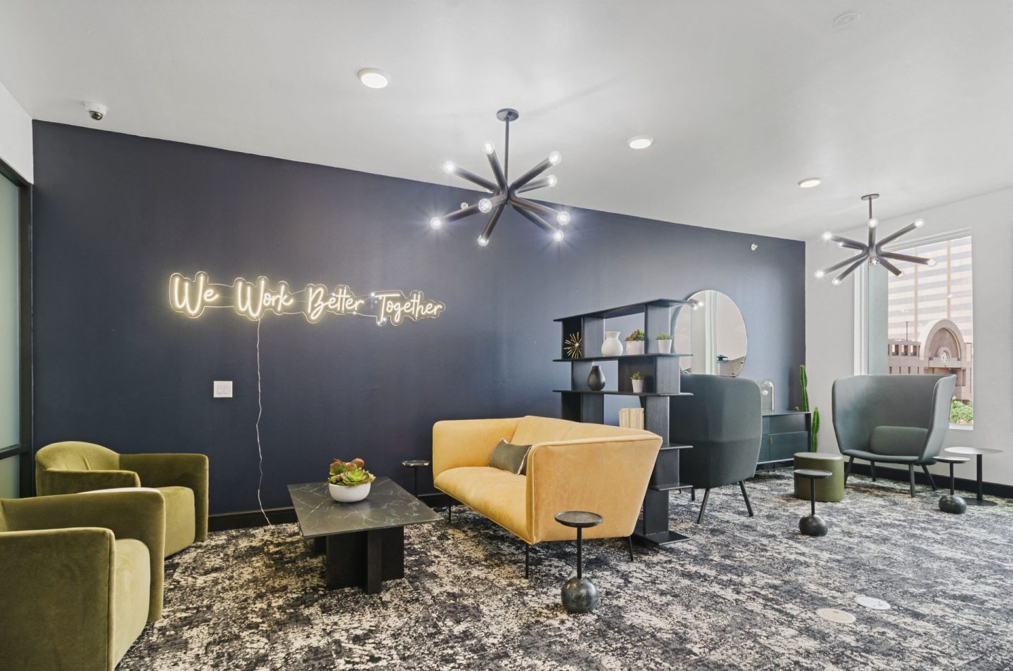 a lobby with couches and chairs and a coffee table