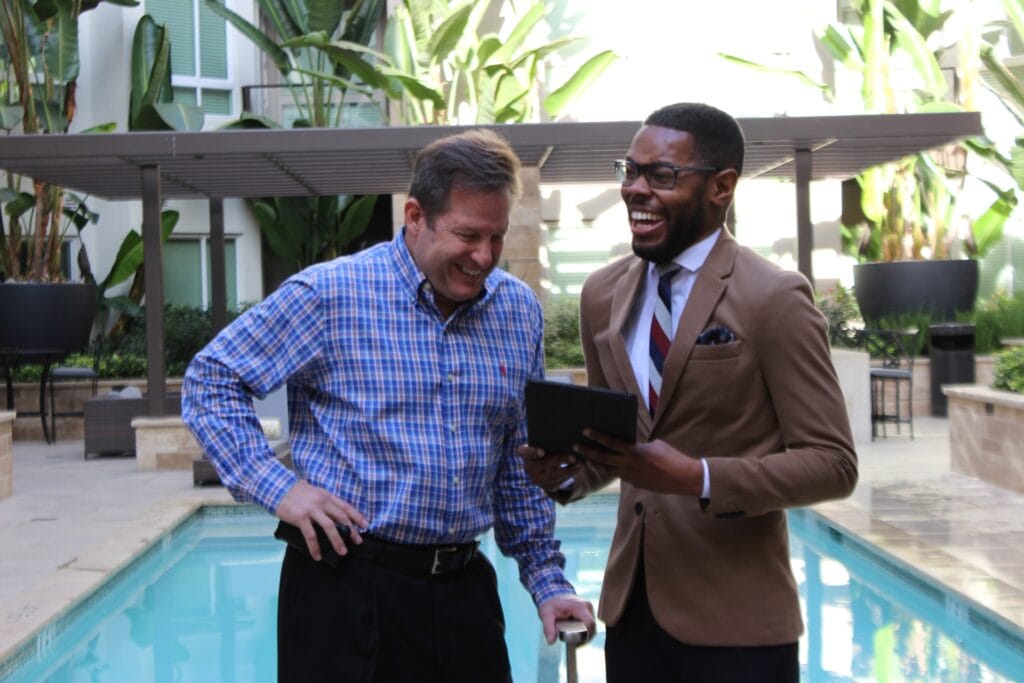 two men laughing together