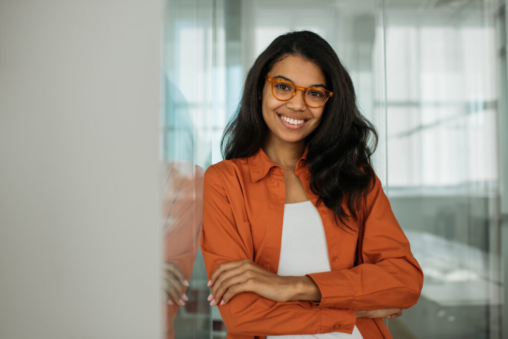woman with glasses smiling