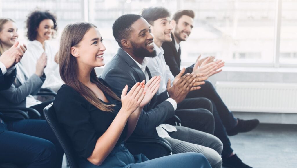 group of professionals clapping