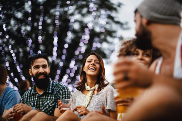 Friends having some beers at a concert.