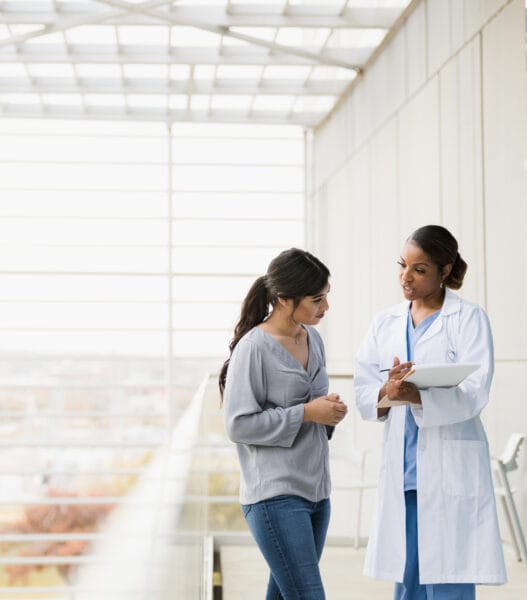 Doctor explains patient's test results to family member