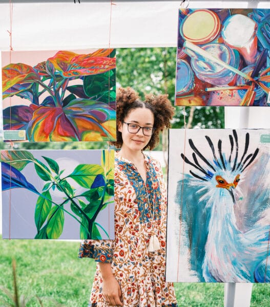 Young Latin woman artist selling her art at Outdoor Market