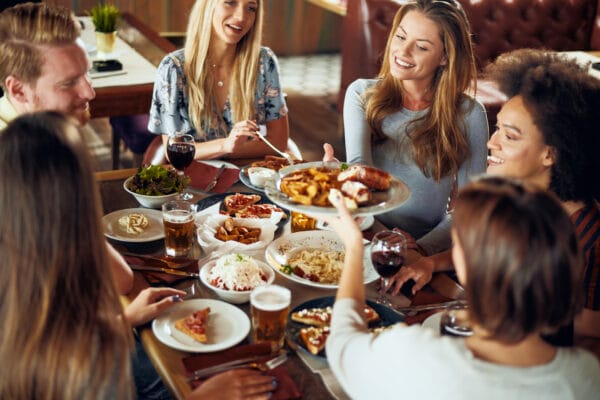 Friends having dinner at restaurant.