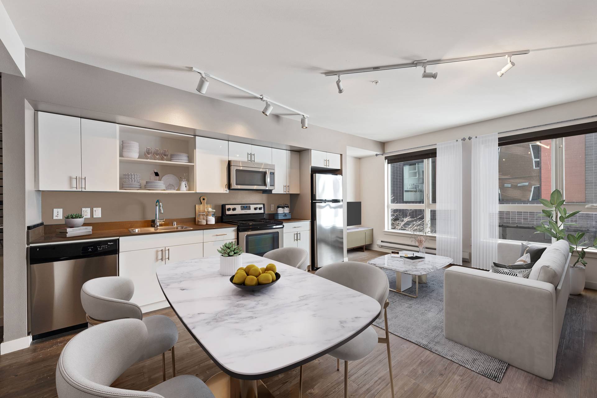 A modern kitchen with a dining table and chairs.