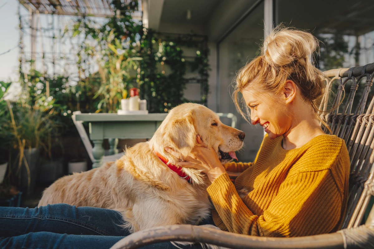 A woman sitting with her dog