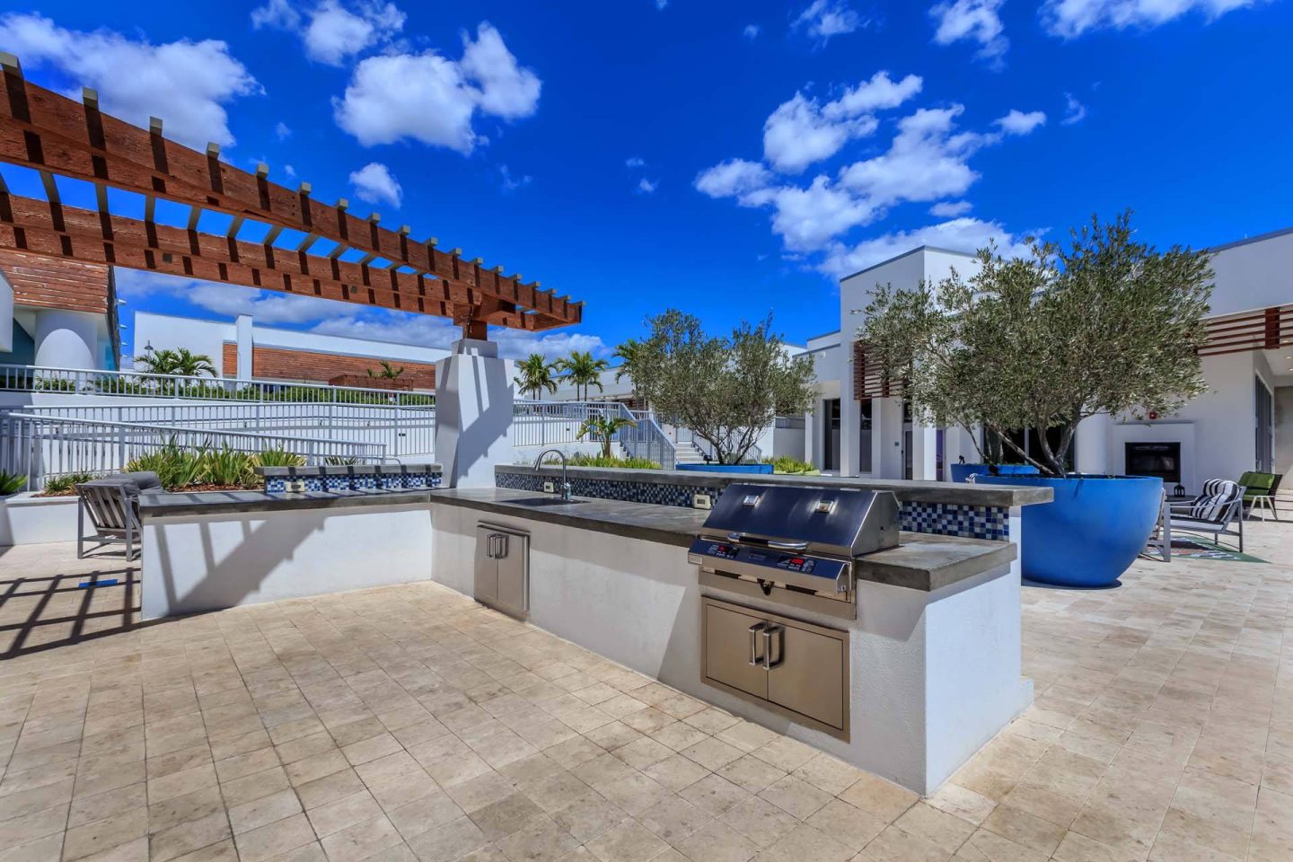 A modern outdoor kitchen with a grill and sink at Windsor Central Arts in St. Petersburg, 33701